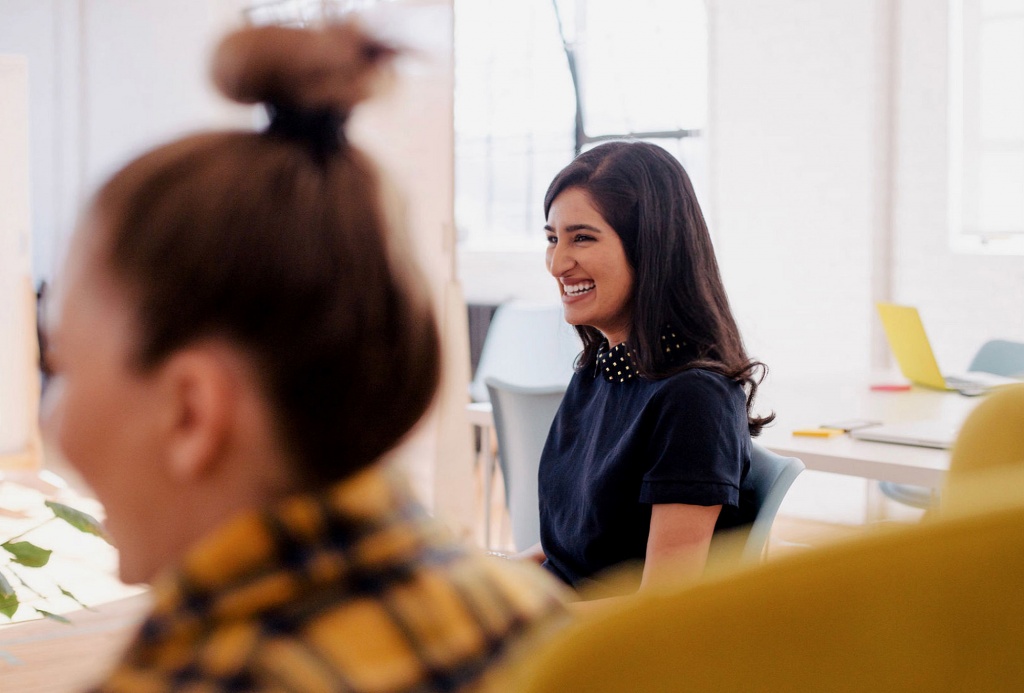 Woman smiling during a business meeting
